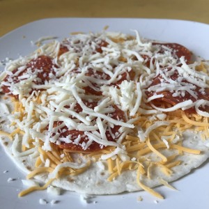 Pizzadilla on plate before being cooked